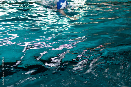 Swimming pool with blue and transparent water. Competition at a sports event.