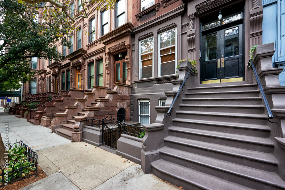 a view of a row of historic brownstones in an iconic neighborhood of Manhattan, New York City