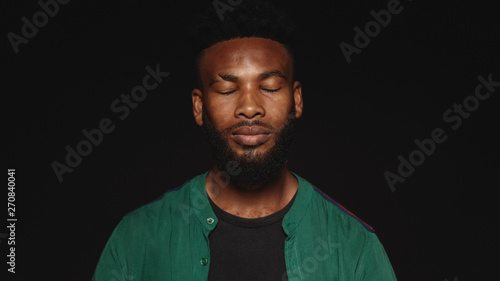 Portrait of african man with eyes closed