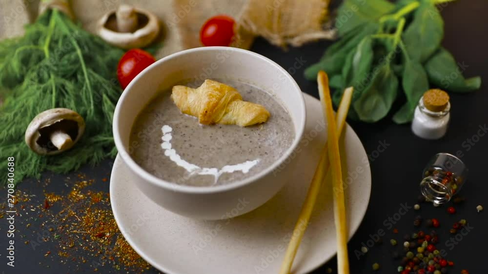 mushroom cream soup on white wooden board. top view. Healthy food, top view. Black background . Slow-mo mushroom cream soup on white wooden board. top view. Healthy food, top view. Black background . Slow-mo