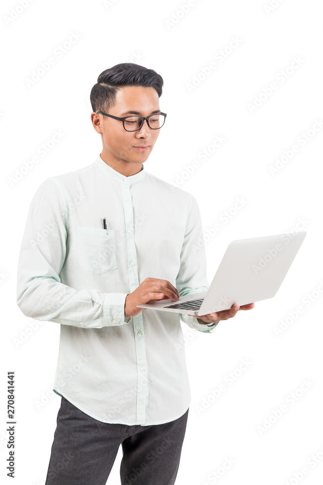 Calm Asian man in glasses with laptop Calm Asian man in glasses with laptop