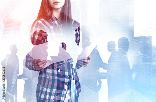 Woman with documents and her colleagues in city