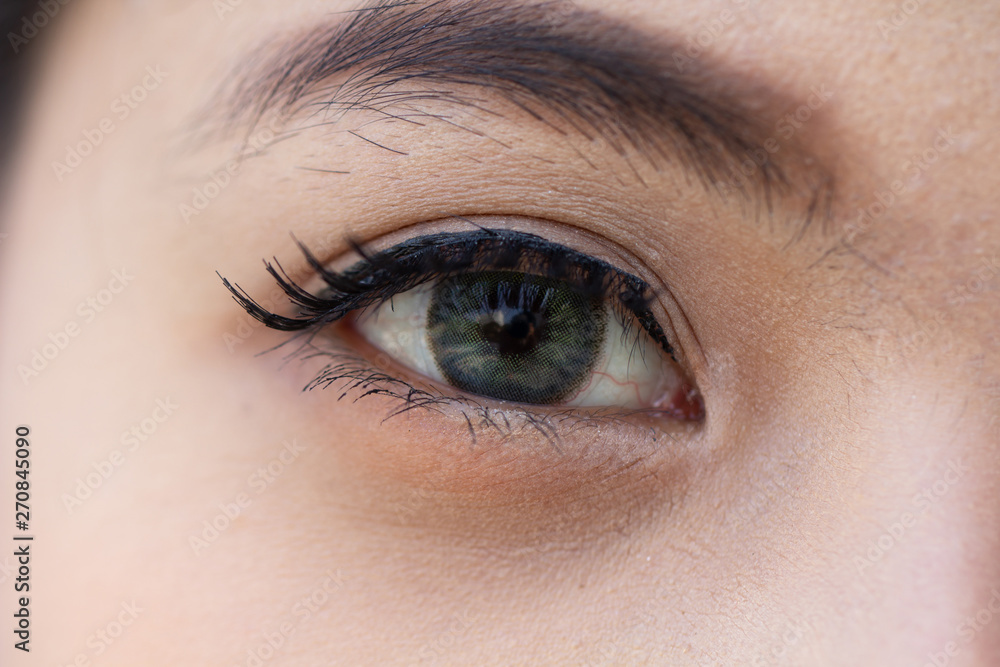 Close up eye with contact lens, macro shot. Beautiful woman single eye surface close up. Beauty cosmetic female concept. Close up eye with contact lens, macro shot. Beautiful woman single eye surface close up. Beauty cosmetic female concept.