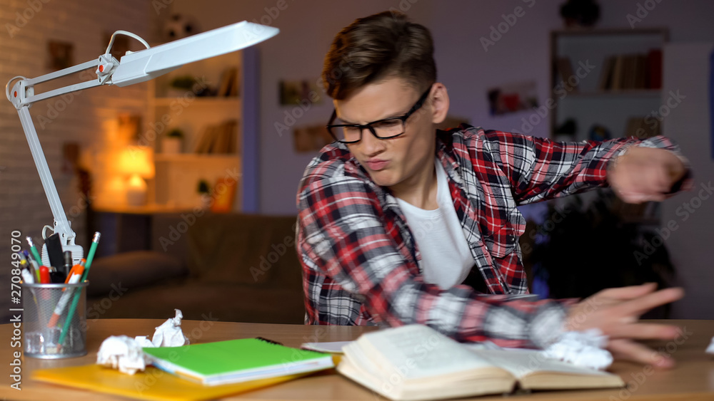 Aggressive student throwing books of table, cannot solve assignment, hard task Aggressive student throwing books of table, cannot solve assignment, hard task