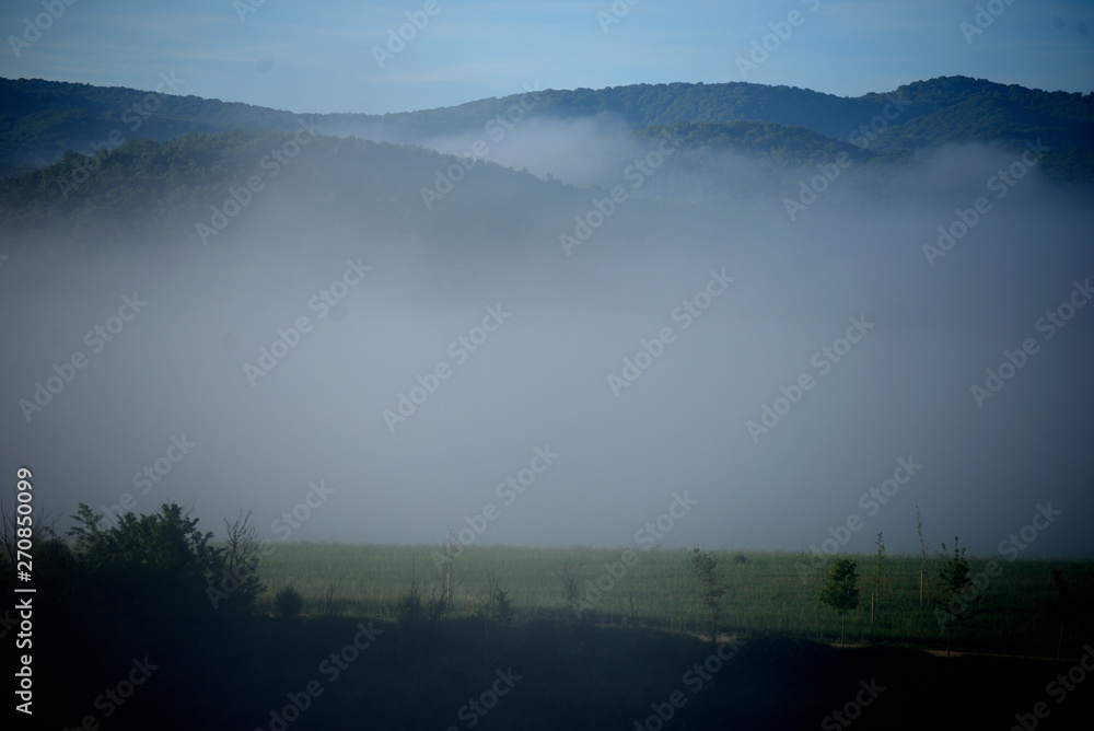 spring sunrise. The fog dissolves slowly and the sun begins to shine. Vitoria-Gasteiz (Alava), Basque Country, Spain. cerro de las neveras, anillo verde. (hill of refrigerators, green ring)