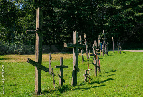 Old wooden orthodox crosses in line photo