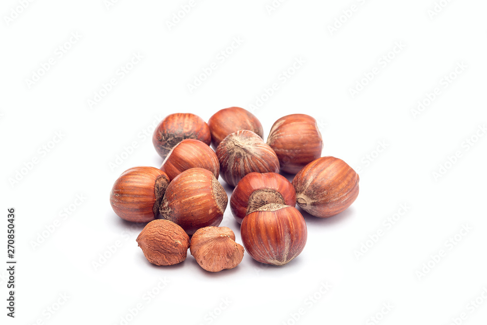 Group of hazelnuts in a shell isolated on white background Group of hazelnuts in a shell isolated on white background