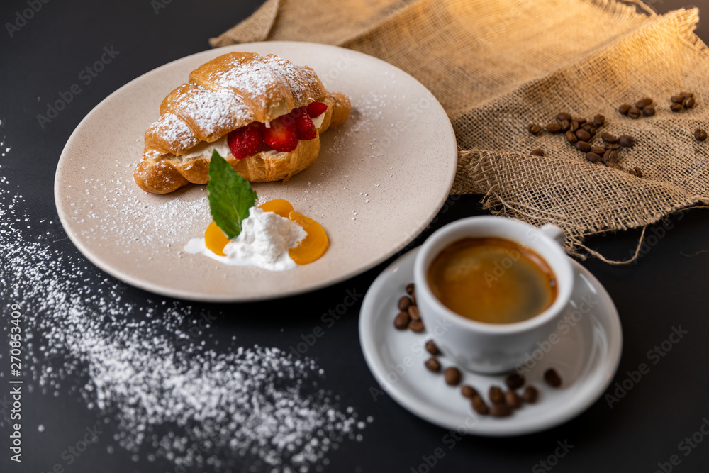 Breakfast with fresh croissants, cup of coffee and strawberry jam on a Black background, Slow-mo Breakfast with fresh croissants, cup of coffee and strawberry jam on a Black background, Slow-mo