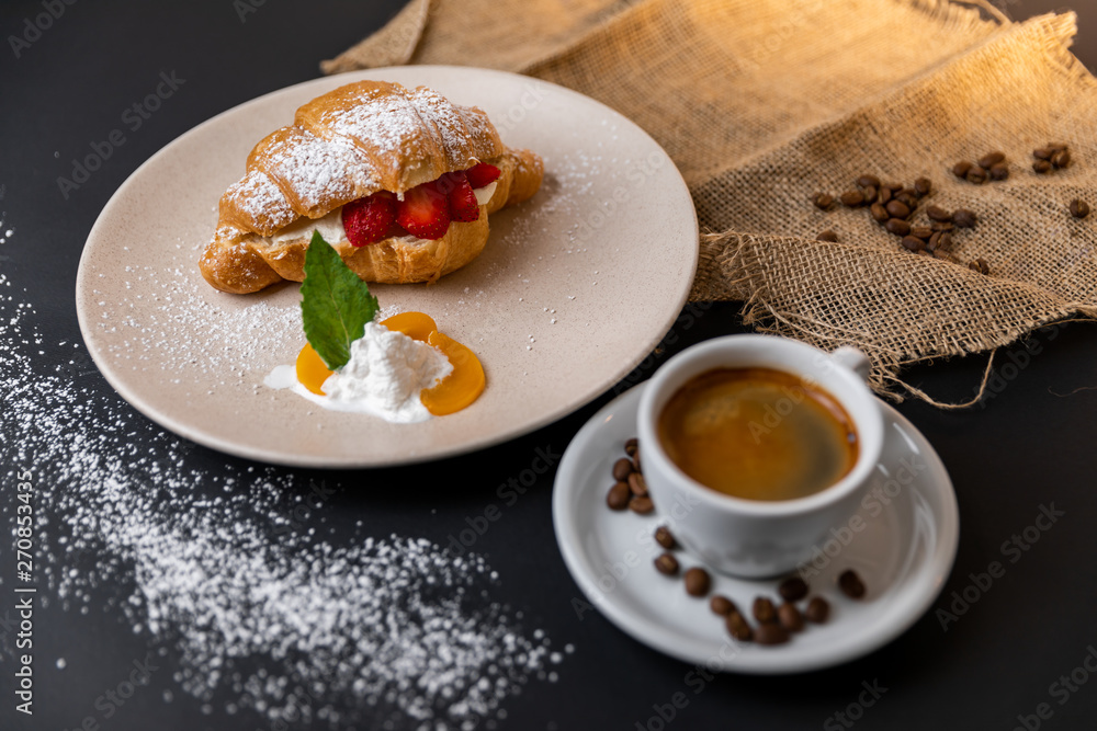 Breakfast with fresh croissants, cup of coffee and strawberry jam on a Black background, Slow-mo Breakfast with fresh croissants, cup of coffee and strawberry jam on a Black background, Slow-mo
