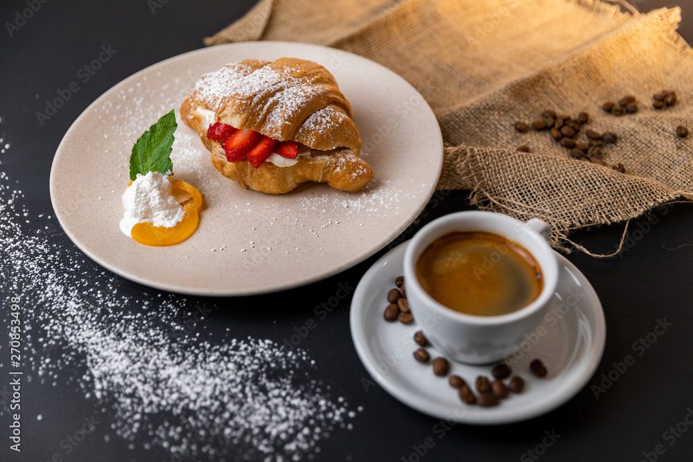 Breakfast with fresh croissants, cup of coffee and strawberry jam on a Black background, Slow-mo Breakfast with fresh croissants, cup of coffee and strawberry jam on a Black background, Slow-mo