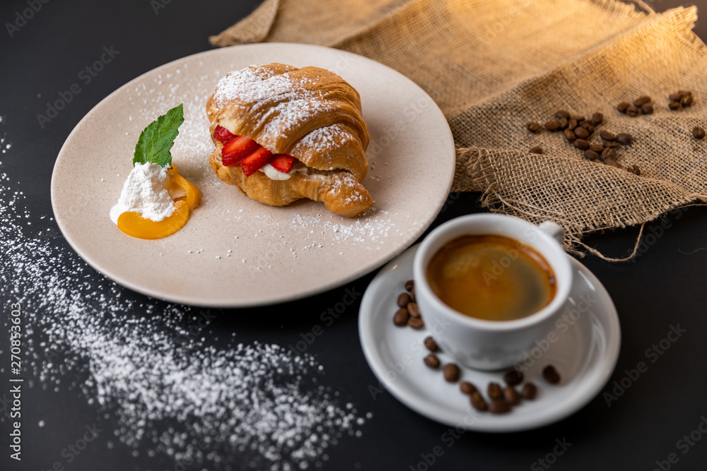 Breakfast with fresh croissants, cup of coffee and strawberry jam on a Black background, Slow-mo Breakfast with fresh croissants, cup of coffee and strawberry jam on a Black background, Slow-mo