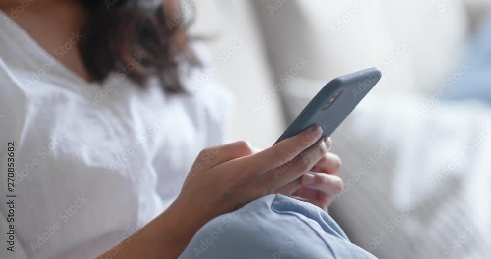 Woman use of smart phone at home Woman use of smart phone at home