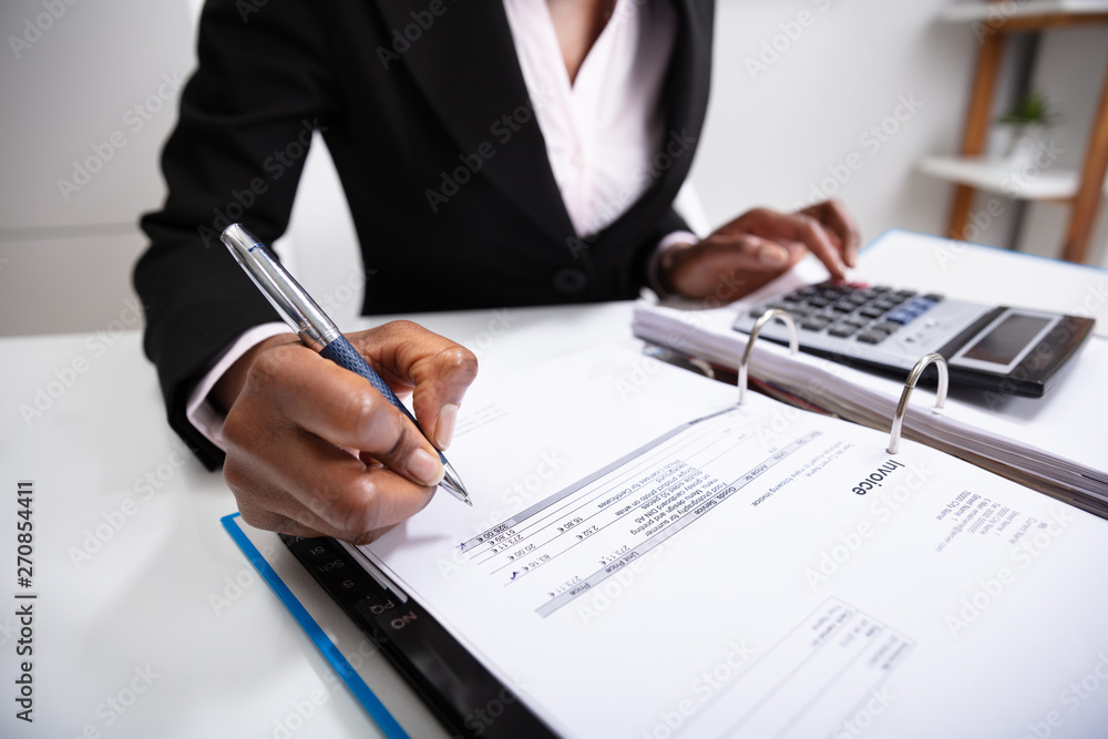 Businesswoman Calculating Bill Businesswoman Calculating Bill