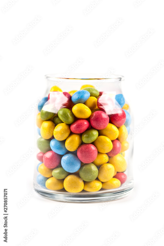 Colorful sweet candies in glass jar isolated on white. Colorful sweet candies in glass jar isolated on white.