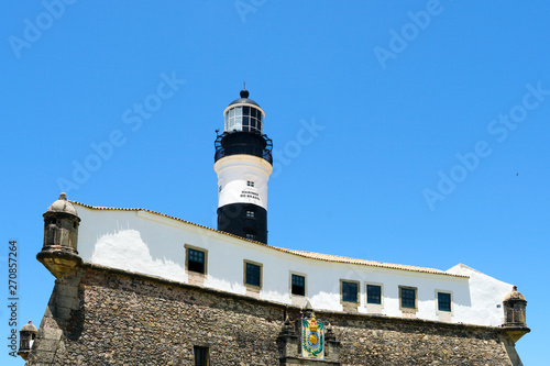 Farol da Barra (Barra Lighthouse) in Salvador, Bahia, Brazil. The historic architecture of Salvador in Bahia, the Farol da Barra Lighthouse at Bahia de Todos os Santos Bay.