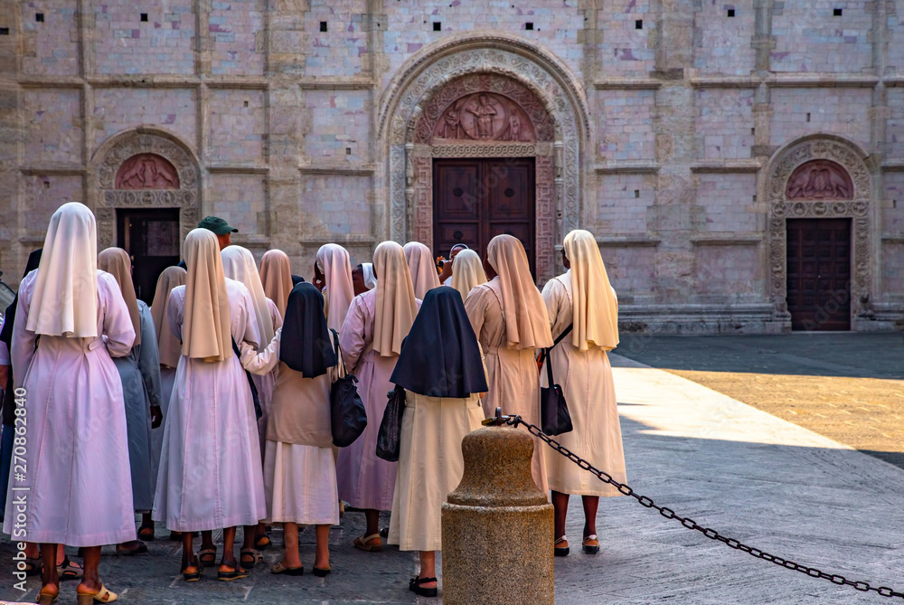 Italy beauty, nuns and San Rufino cathedral in Assisi
