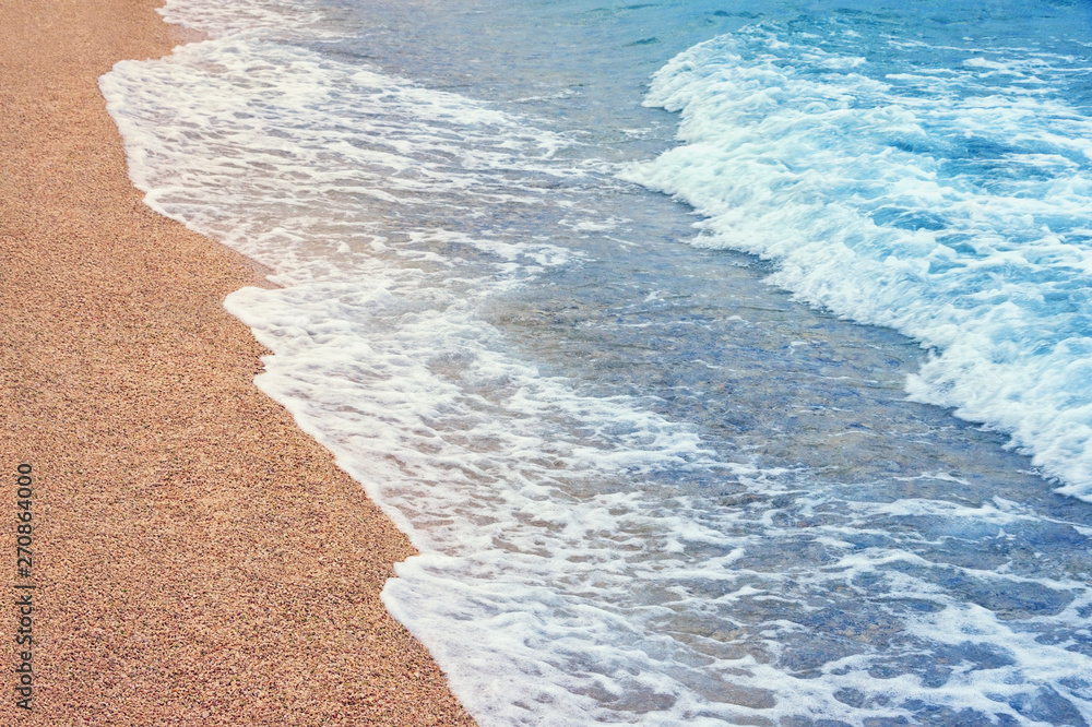 Wave on a sandy beach. Montenegro, Adriatic Sea, Kotor Bay