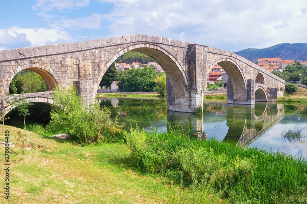 Fototapeta premium Ancient stone bridge. Bosnia and Herzegovina, Trebinje city. View of Arslanagic ( Perovic ) Bridge over Trebisnjica river