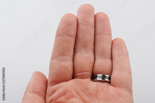 Man palm with black ring on