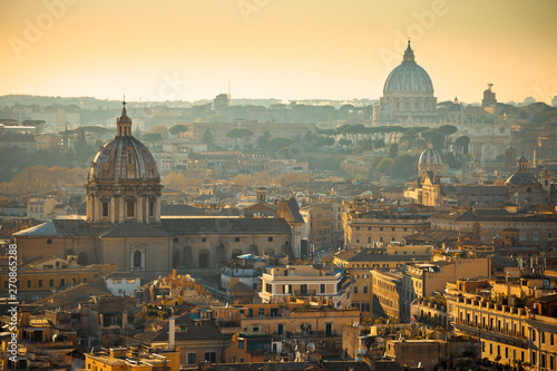 Eternal city of Rome rooftops and towers golden sunset view