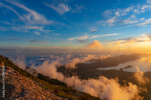 Sunset mountain peaks sky panorama. Mountain peaks sunset view. Mountain sunset sky clouds