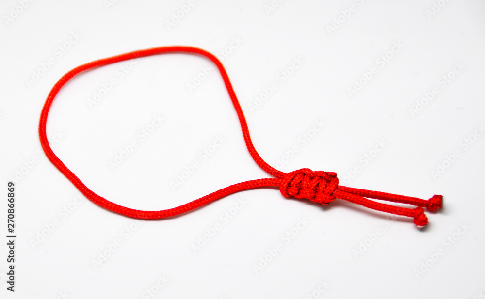 delicate decorative bracelet woven from red rope delicate decorative bracelet woven from red rope