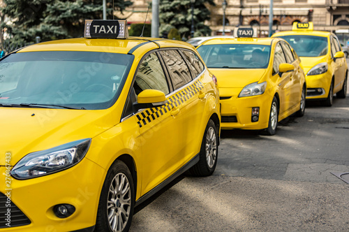 Many yellow taxi cars standing on the Hungarian road