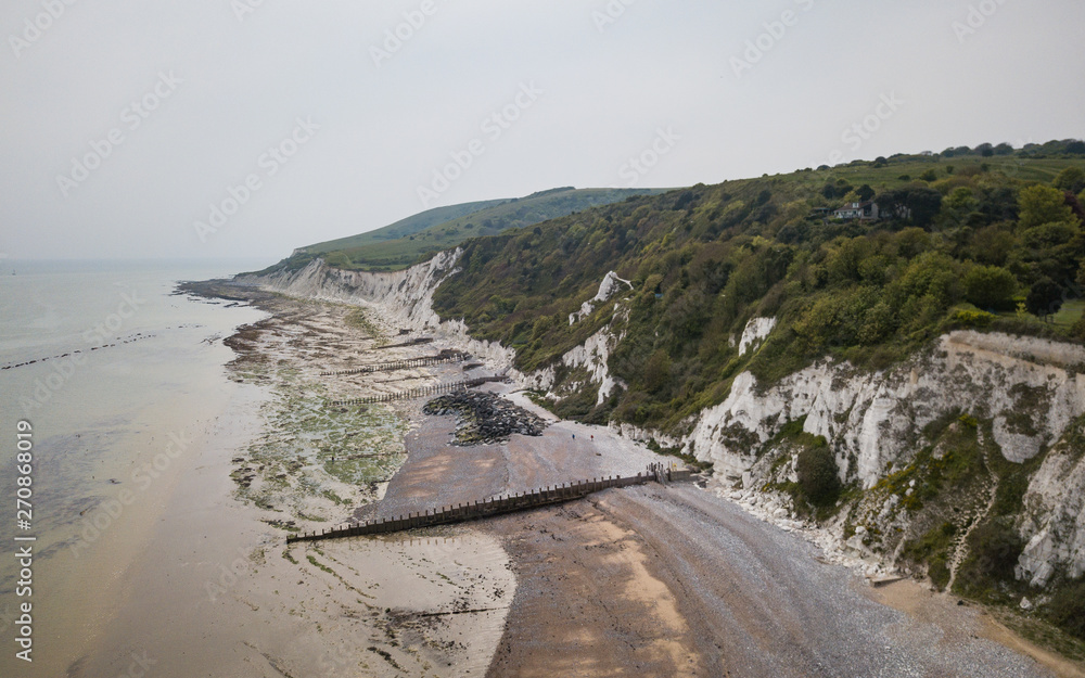 White cliffs, Eastbourne, East Sussex, England. The chalk cliffs of the South Downs and the rocky coastline of the Sussex coast of England.