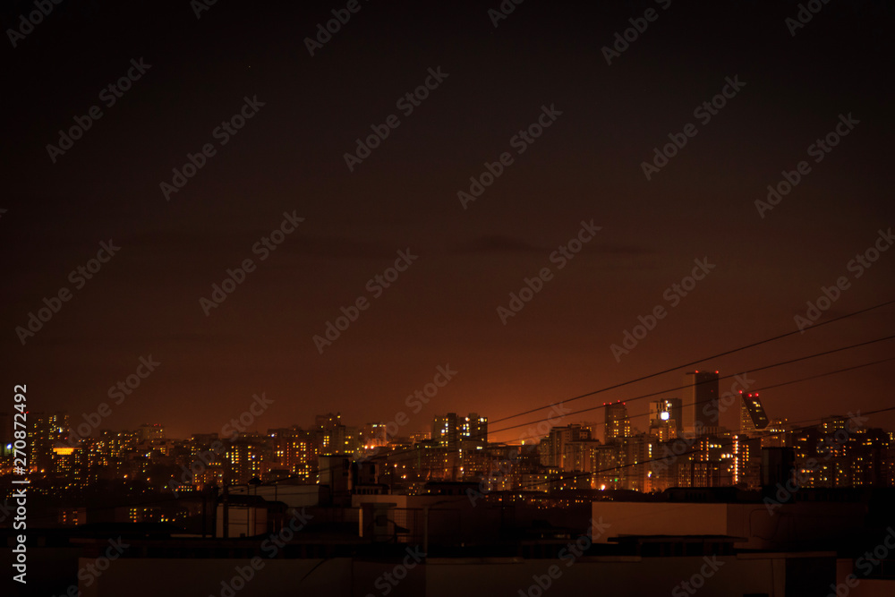 City downtown Sunset.City skyline in the dusk. Amazing panoramic view of modern city.Construction site with cranes on new residential areas