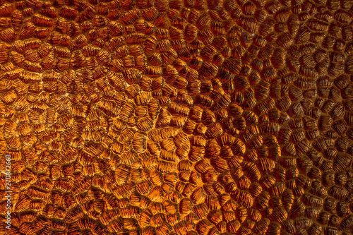 Glowing amber colored patterned glass