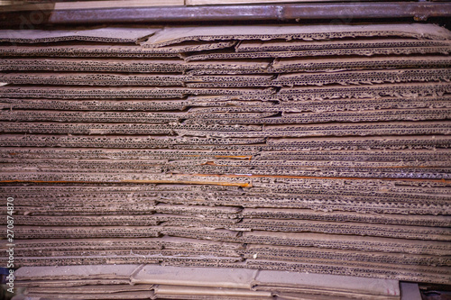 The cardboard is stacked. Paper manufacture. The texture of the cardboard. Pressed paper for packaging. To make paper you need wood. photo