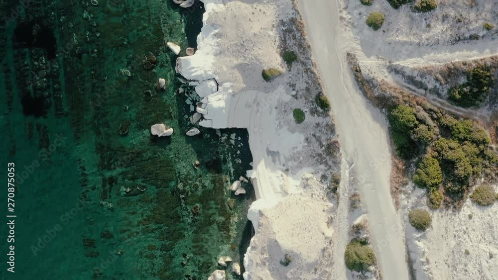 Hiking trail along rocky sea shore with crystal clear water Hiking trail along rocky sea shore with crystal clear water
