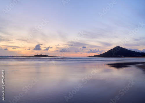 Beach of moledo at the end of the day  with a view to trega mountain on spanish side of the border. Low tide displaying the sandy beach on a cloudy day.