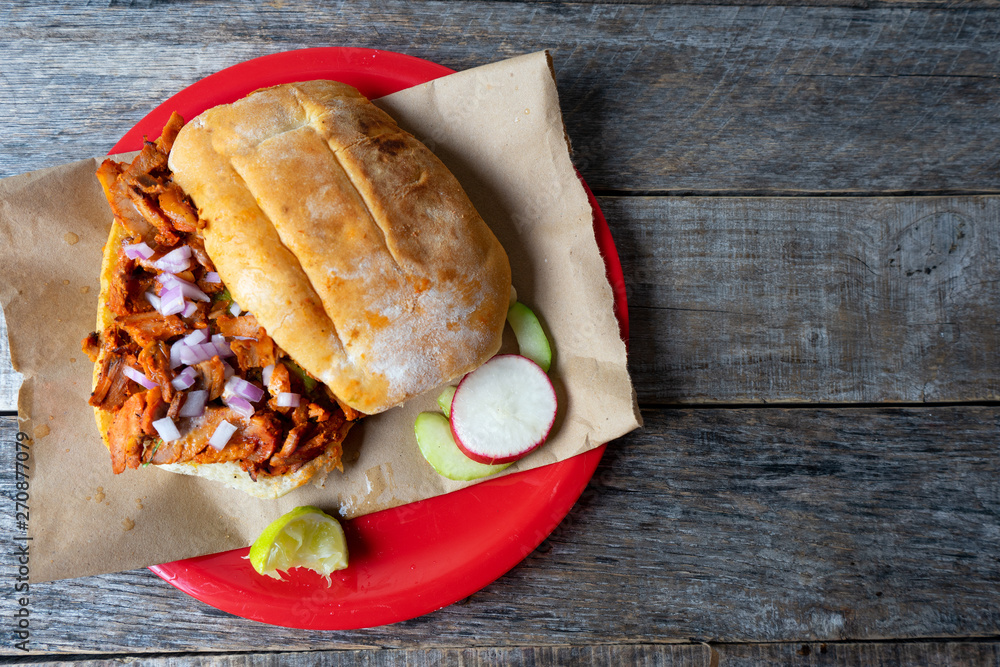 Mexican food pork sandwich also known as "torta al pastor" Stock Photo