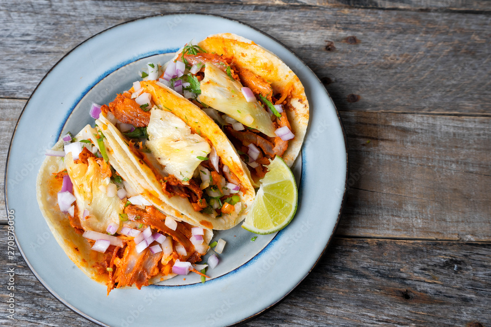 Mexican food: Authentic tacos al pastor with lime and pineapple Mexican food: Authentic tacos al pastor with lime and pineapple