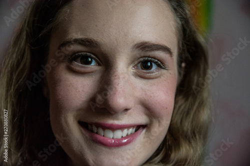 Portrait of a young beautiful smiling girl close-up.