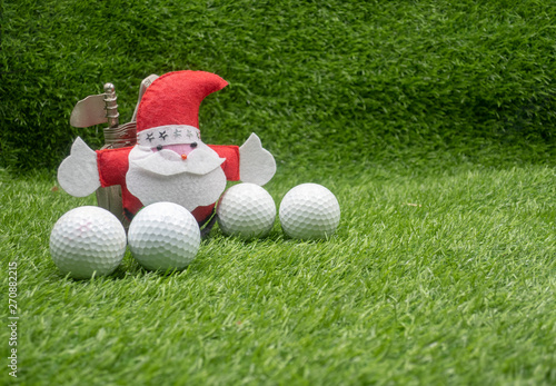Merry Christmas to Golfer with Santa and golf balls on green