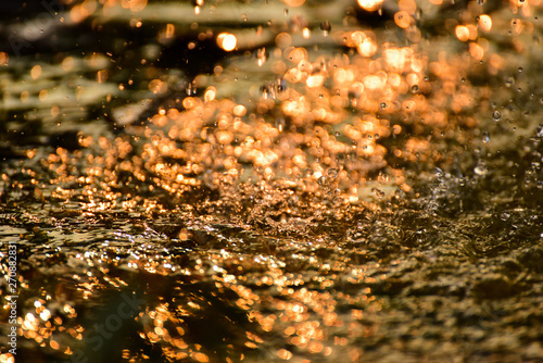 Water splashes with sunlight
