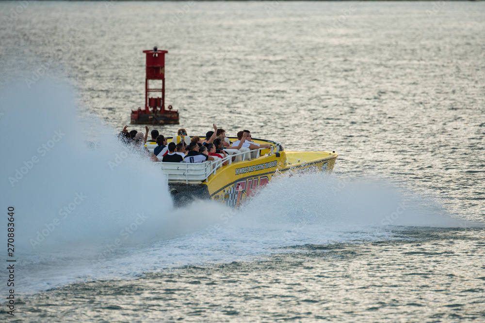 Fototapeta premium Thriller Miami speedboat with tourists excited for speed