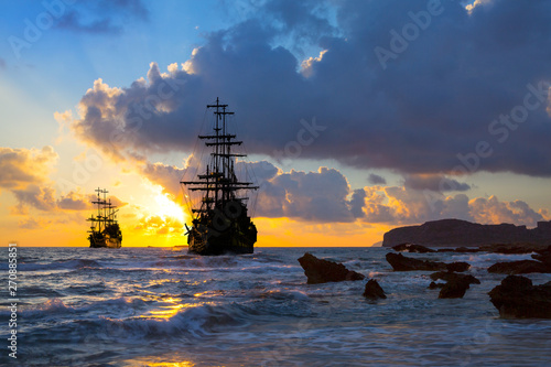 Canvas-taulu Old ship silhouette in sunset scenery