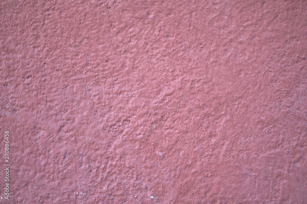 Fototapeta premium pink plaster on a concrete wall