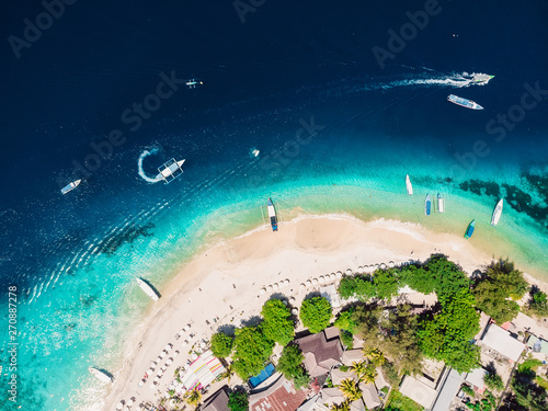 Tropical island with white tropical beach and turquoise crystal ocean, aerial view. Gili islands photo