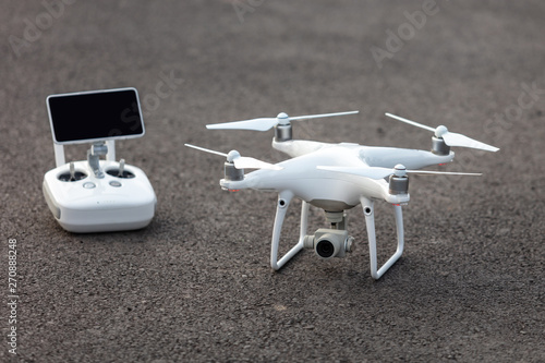 The View of a White Aerial Photographic UAV In the Air.