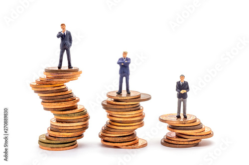 Miniature businessman on stack on white background. Concept uncertainty business market.