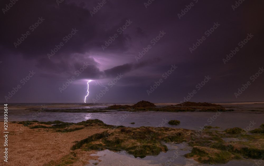 Thunderstorm on mediterranean sea beach