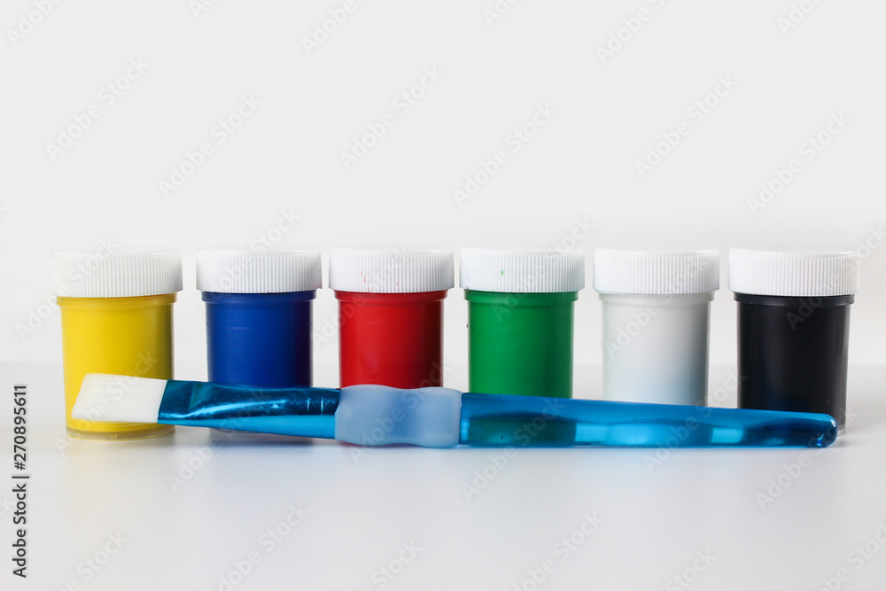 Set gouache paints for children isolated on a white background Set gouache paints for children isolated on a white background