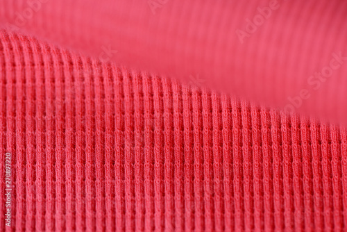 Textile texture coral color close up. Textile background