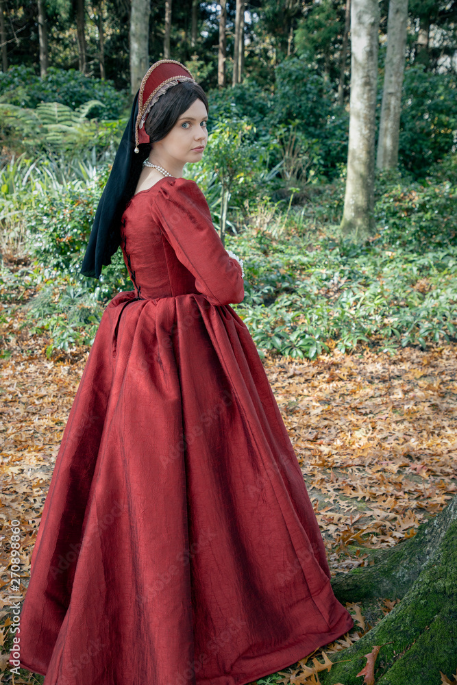 Dark-haired Tudor woman in red dress