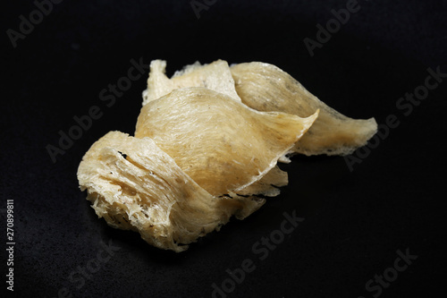 The nest of Edible-Nest Swiftlet, raw edible bird's nest materials for tradition chinese medicine. photo