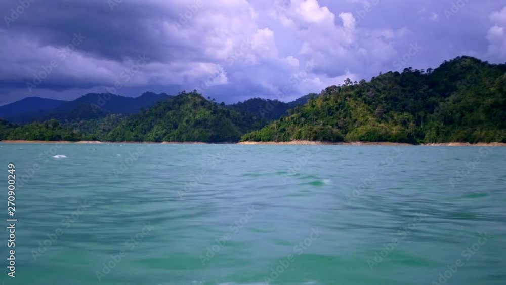 Traveling on a boat between mountains Traveling on a boat between mountains